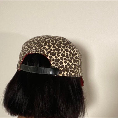 Undercover leopard print baseball cap with red inner