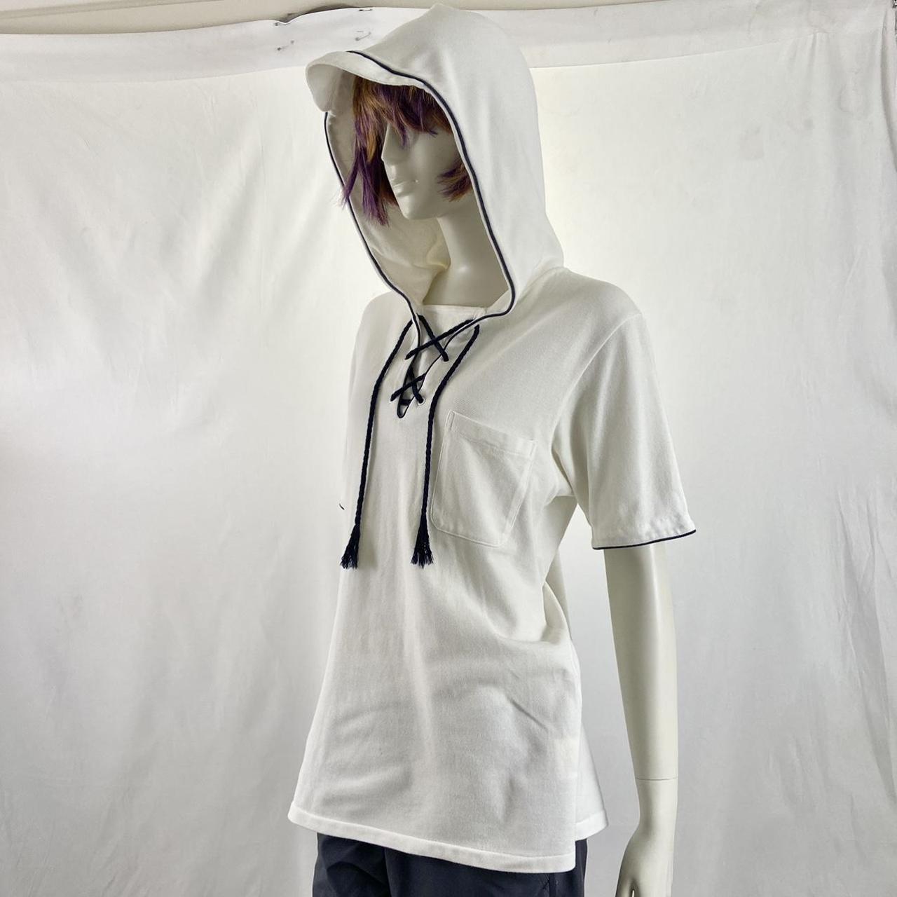 Undercover “Undercoverism” polo hoodie with cap brim hood detail and lace up collar